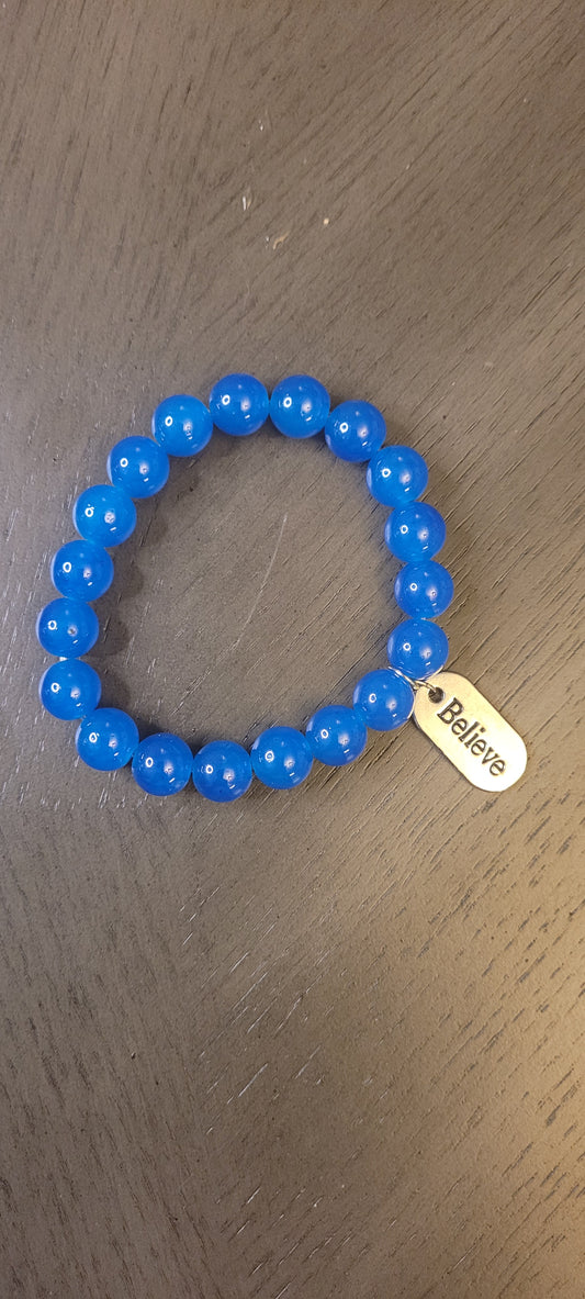 Royal blue bracelet with charm believe