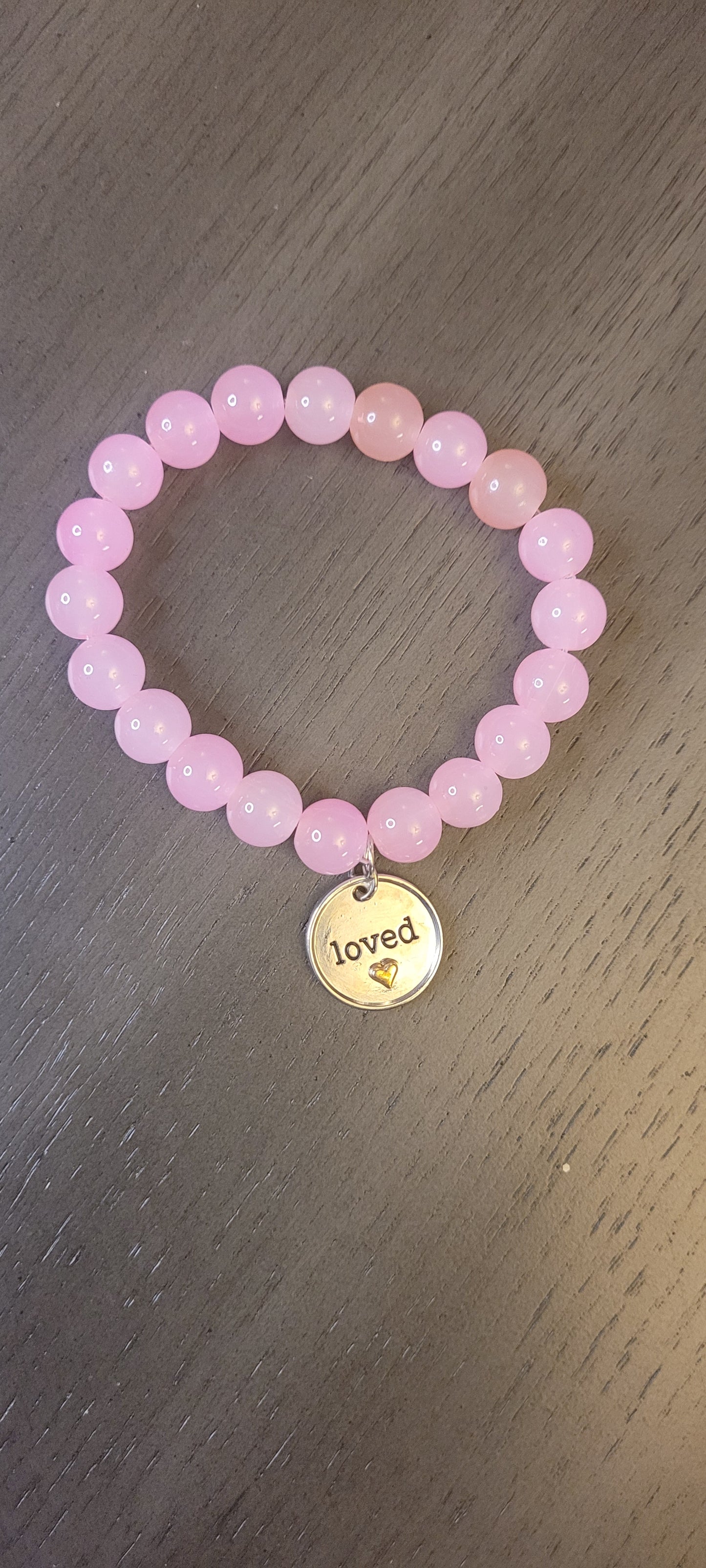 Pink bracelet with Love charm