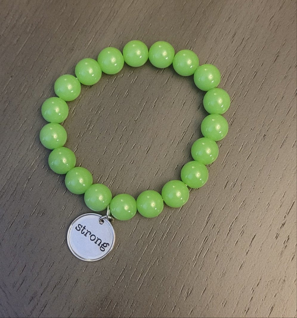 Lime green stretch bracelet w/ strong charm