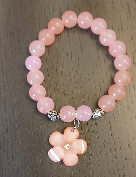 Pink stretch bracelet with flower charm