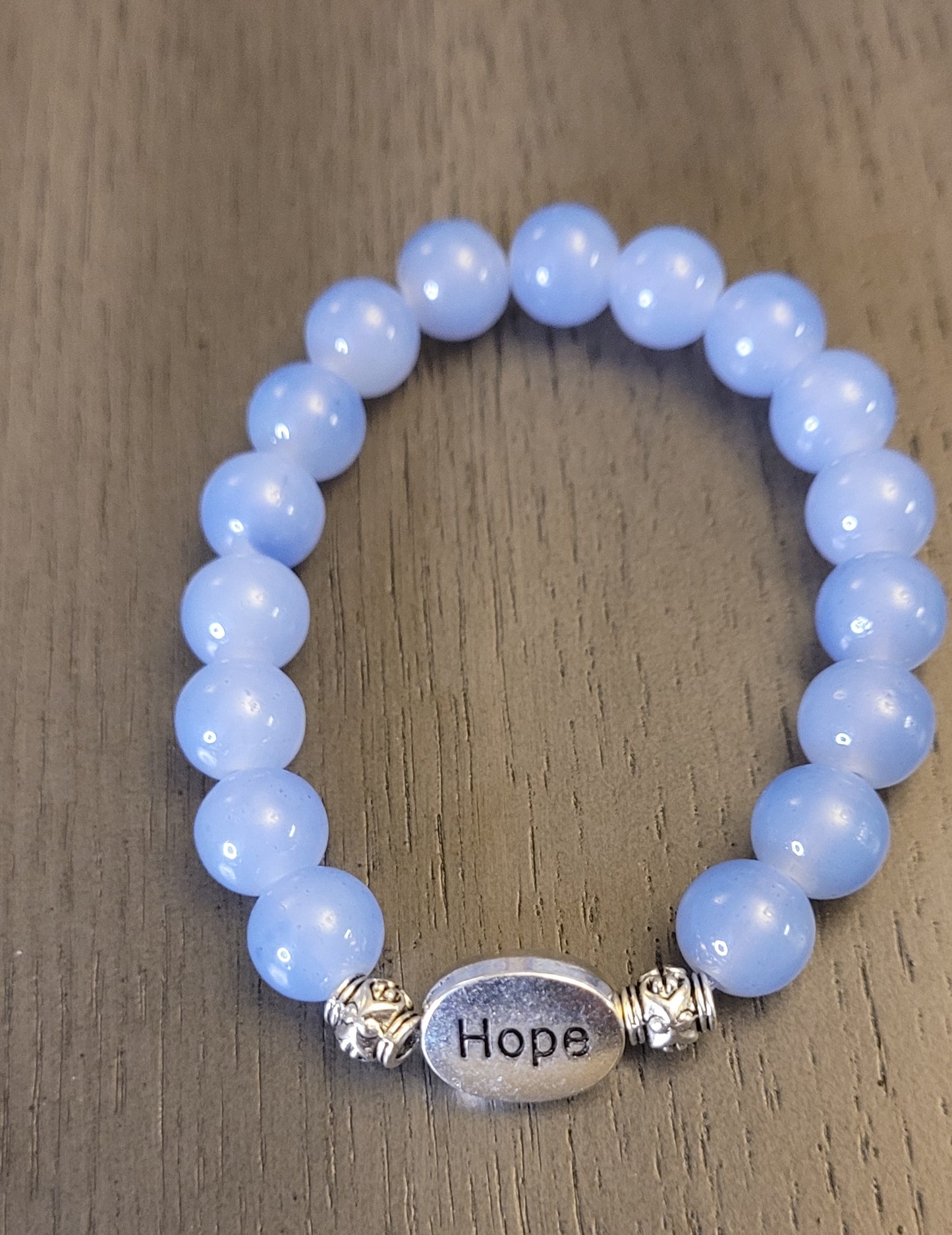 Blue glass bead stretch bracelet w/hope charm