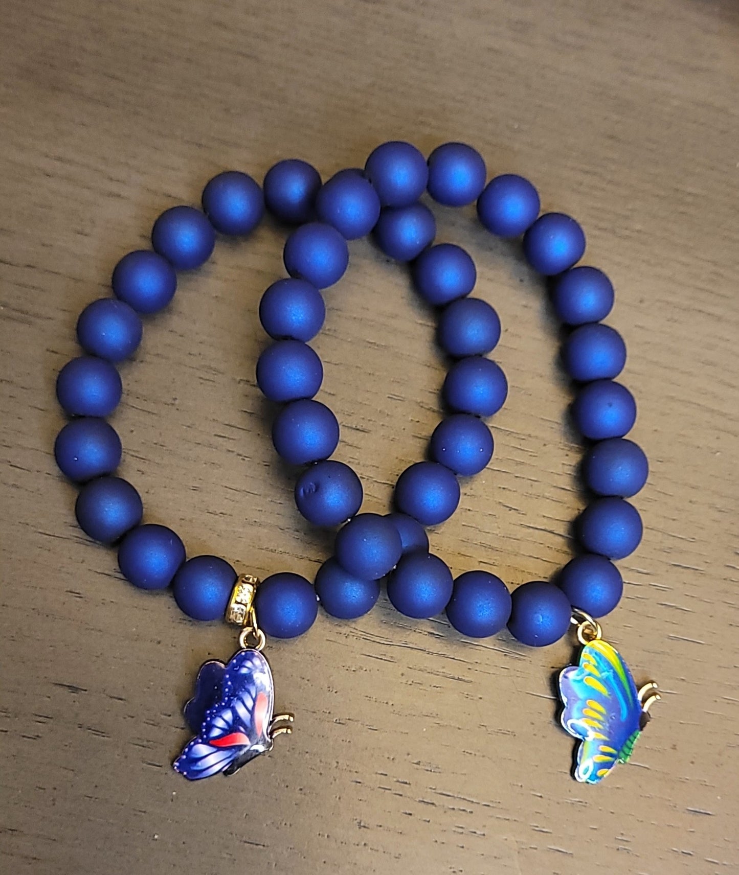 Dark blue bracelet w/butterfly charm