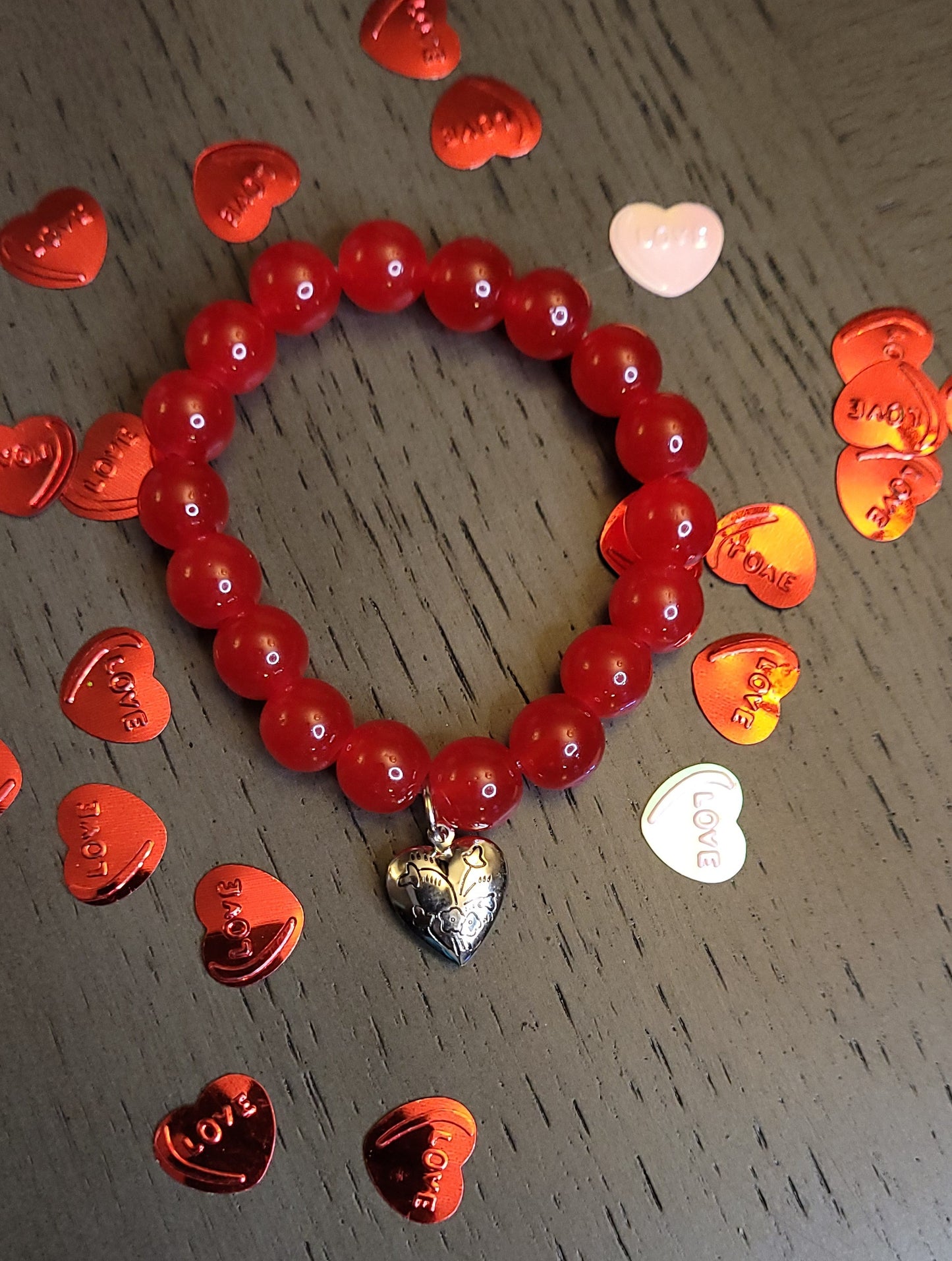 Red bracelet w/ heart charm